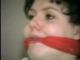 19 Yr OLD JENNIFER IS MOUTH STUFFED, TAPE GAGGED, TIED WITH ARMS OUT AND TO 2 PILLARS & CLEAVE GAGGED (D48-10)d, bondage