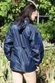 SEXY MARA wearing only a darkblue rain jacket and rubber boots while examining the garden and being sprinkled with water out of the garden hose (Pics)
