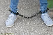 Cuffed to a heavy container