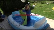 Pia ties and gagges herself in a small swimming pool wearing sexy lightblue downwear (Video)