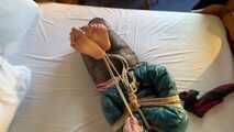 Rachel Adams tied and gagged in shiny Downwear