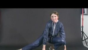 Anastasia posing infront of the camera wearing supersexy blue AGU rainwear (Video)