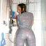 Stella wearing a supersexy grey rainwear catsuit under the shower (Pics)
