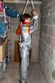 Nicole in an silver shiny PVC sauna suit tied and gagged in an cellar (Pics)