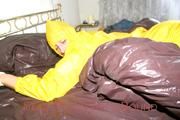 Stella tied and gagged on a bed wearing a supersexy yellow rainwear combination (Pics)