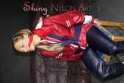 Sexy Sandra wearing sexy red/blue rainwear being tied and gagged with ropes and a clothgag on a chair (Pics)
