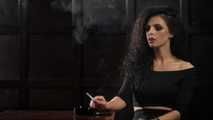 Gorgeous brunette Daria enjoying a cigarette in the hot smoking video