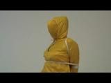 03:00 Min. video with Jill tied and gagged in a shiny nylon yellow rainsuit