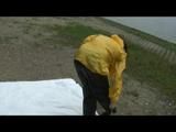 Being with Enni sitting at a lake wearing sexy shiny nylon rainwear (Video)