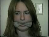 24 Yr OLD CRAFTER IS CLEAVE GAGGED, MOUTH STUFFED, HAND GAGGED, OTM GAGGED & TIED TO A CHAIR (D55-6)