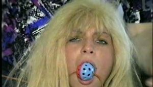 BOMBSHELL TRACY GETS RING-GAGGED, SPONGE IN MOUTH, TAPE-GAGGED & CROTCH ROPED (D33-2)