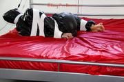 Jill bound and gagged in a shiny pvy sauna suit