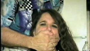 34 Yr OLD LATINA HOUSEKEEPER WITH BIG TITS IS BEING HELD HOSTAGE & IS MOUTH STUFFED WITH SPONGE & RAG, TIED TO A CHAIR, CROTCH ROPED WHILE WEARING BLACK LACE TEDDY (D57-4)