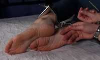 Rose hogtied on bed
