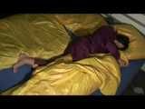 ENNI wearing a sexy purple shiny nylon rain suit lying in bed with yellow shiny nylon cloths lolling and posing (Video)