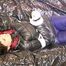 Mara tied, gagged and hooded on a black covered sofa wearing a blue rain pants and a black down jacket (Pics)