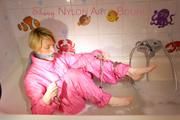 Sonja ties and gagges herself in the bath tub with cuffs wearing sexy shiny nylon downwear (Pics)