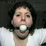 BALL-GAGGED, & TIED BETWEEN  2 PILLARS DAMSEL (D16-12)
