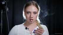 Smoking strong cork cigarette in the studio