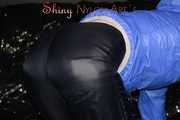 Sexy Sandra wearing a supersexy black shiny nylon rain pants and a sexy shiny blue rain jacket lolling on the sofa (Pics)