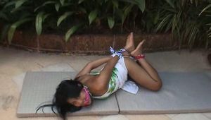 Video of innocent Ahm left struggling outside in a nice tight hogtie