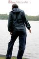 Sexy archive girl wearing a blue rain pant and rain jacket walking on a lake in freetime (Pics)