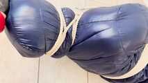 Breathplay Sebastien in a puffer jacket in hogtied.