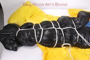 Jill tied and gagged in an big shiny down bag to lie in (Pics)