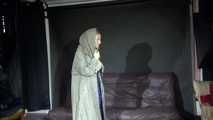 Watching sexy Sandra wearing a supersexy long rainwear skirt trying on several rain coats with hoods (Video)