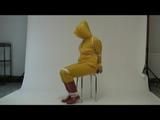 03:00 Min. video with Jill tied and gagged in a shiny nylon yellow rainsuit