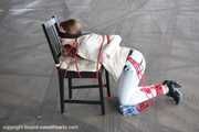 Stella tied hard to chair PICS
