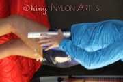 Watching sexy Pia being envelopped in film wearing a sexy blue shiny nylon shorts and a lightblue shiny nylon rainjacket (Pics)