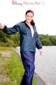 Sexy archive girl wearing a blue rain pant and rain jacket walking on a lake in freetime (Pics)