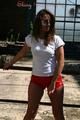 Stella posing outdoor wearing a supersexy red shiny nylon shorts and a white top (Pics)