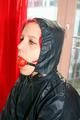 Marlin tied and gagged in a shiny blue rainsuit