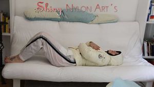 SEXY Jill wearing a WHITE rain pants and a WHITE down jacket lolling on the sofa playing with you (Pics)