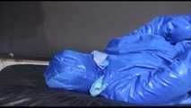 Lucy tied and gagged with ropes on bed wearing sexy blue oldschool downwear (Video)