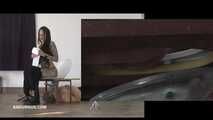 Mistress Cleo squirts cologne into the mouth of the slave lying in the toilet. Picture in Picture