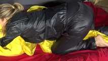 Sexy Sandra wearing sexy shiny nylon rainwear lolling in bed of nylon (Pics)