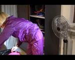 Sonja wearing a sexy purple shiny nylon rainwear combination during reordering the cupboard (Video)