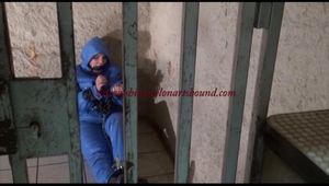 Jill tied, gagged and hooded in an old dungeon/cellar with handcuffs wearing sexy lightblue downwear (Video)