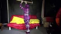 Watching sexy Sonja wearing a supersexy purple shiny nylon rainwear combination being tied and gagged overhead with ropes and a clothgag (Video)