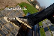 Chucks and naked feet outdoor