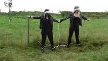 Jasmin & Larissa tied on fence Photoshoot