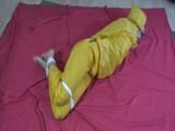 two short videos with our archive girls tid and gagged in shiny nylon rainwear