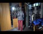 SANDRA putting on a sexy shiny nylon crazy sensation down suit infront of the mirror (Video)