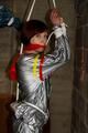Nicole in an silver shiny PVC sauna suit tied and gagged in an cellar (Pics)