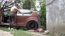 Mistress Jenna stands on the slave with a car while smoking in the slave's mouth B