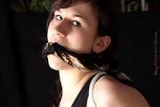 Julia tied and gagged in shiny nylon shorts