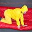 MARA ties, gagges and hoodes herself with cuffs and a ballgag on a sofa wearing sexy yellow rainwear (Pics)
